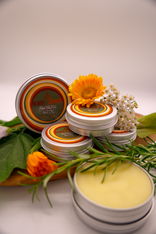 Supreme Salve tins with floral decorations on a white background